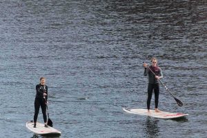 Wakeup Docklands, two paddleboarders