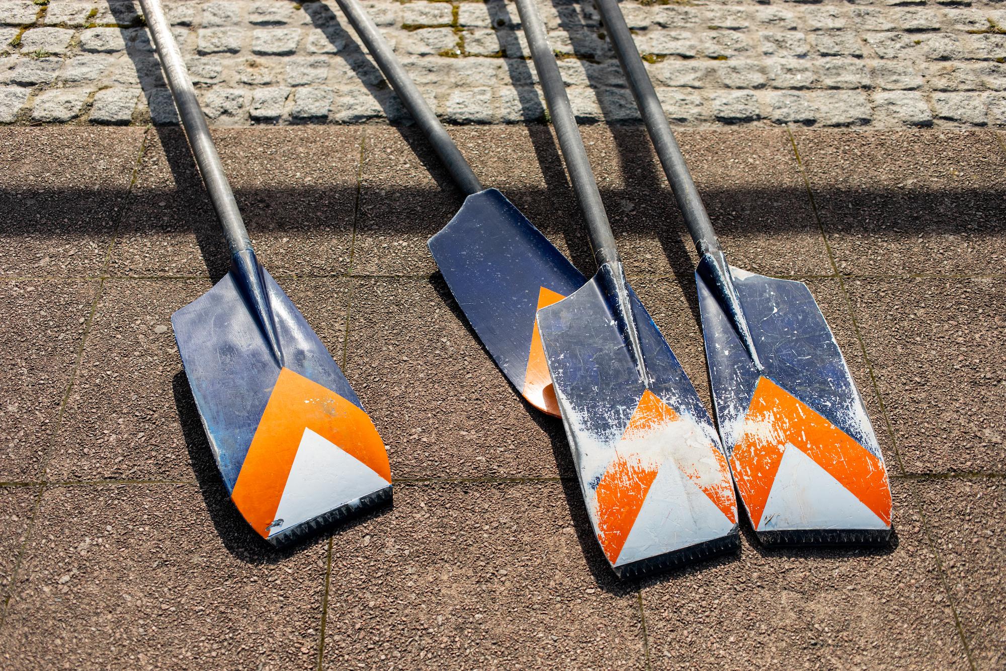orange and blue oars on the ground