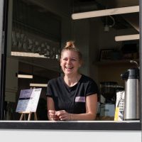 Roxanna at the hatch of Perky Blenders coffeeshop