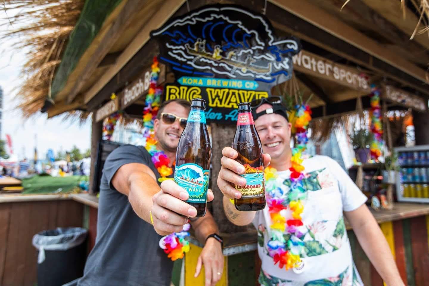 Two men enjoying the beach bar at the Royal Docks