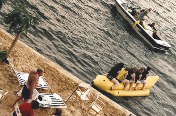 Group of people riding a banana boat in the Royal Docks