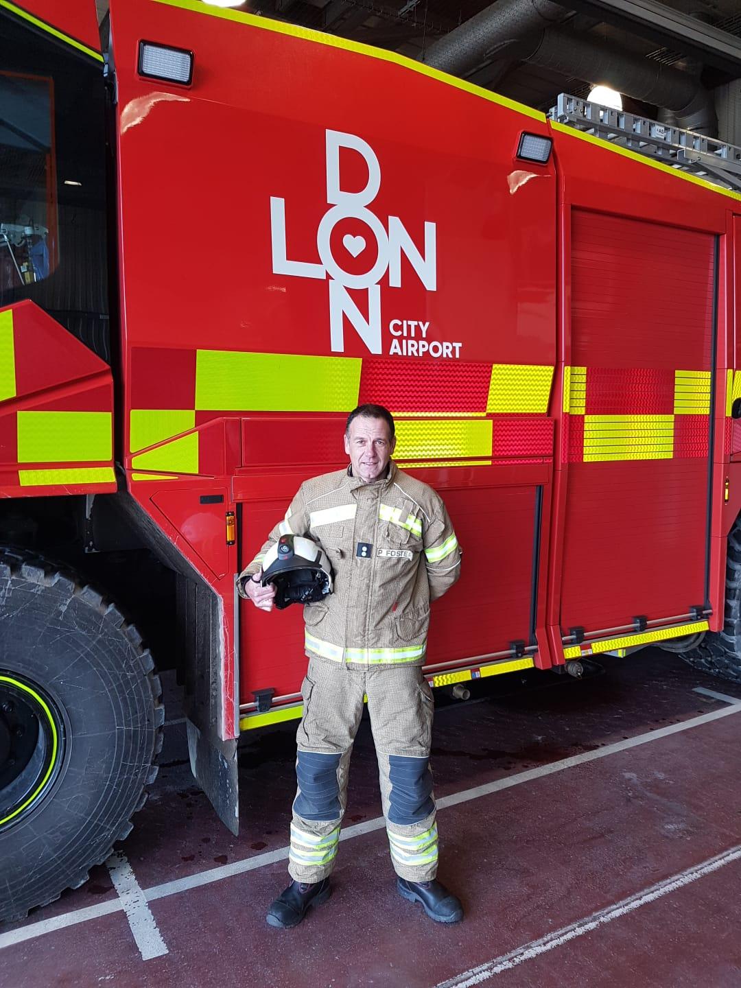 Paul Foster in front of a Fire Engine