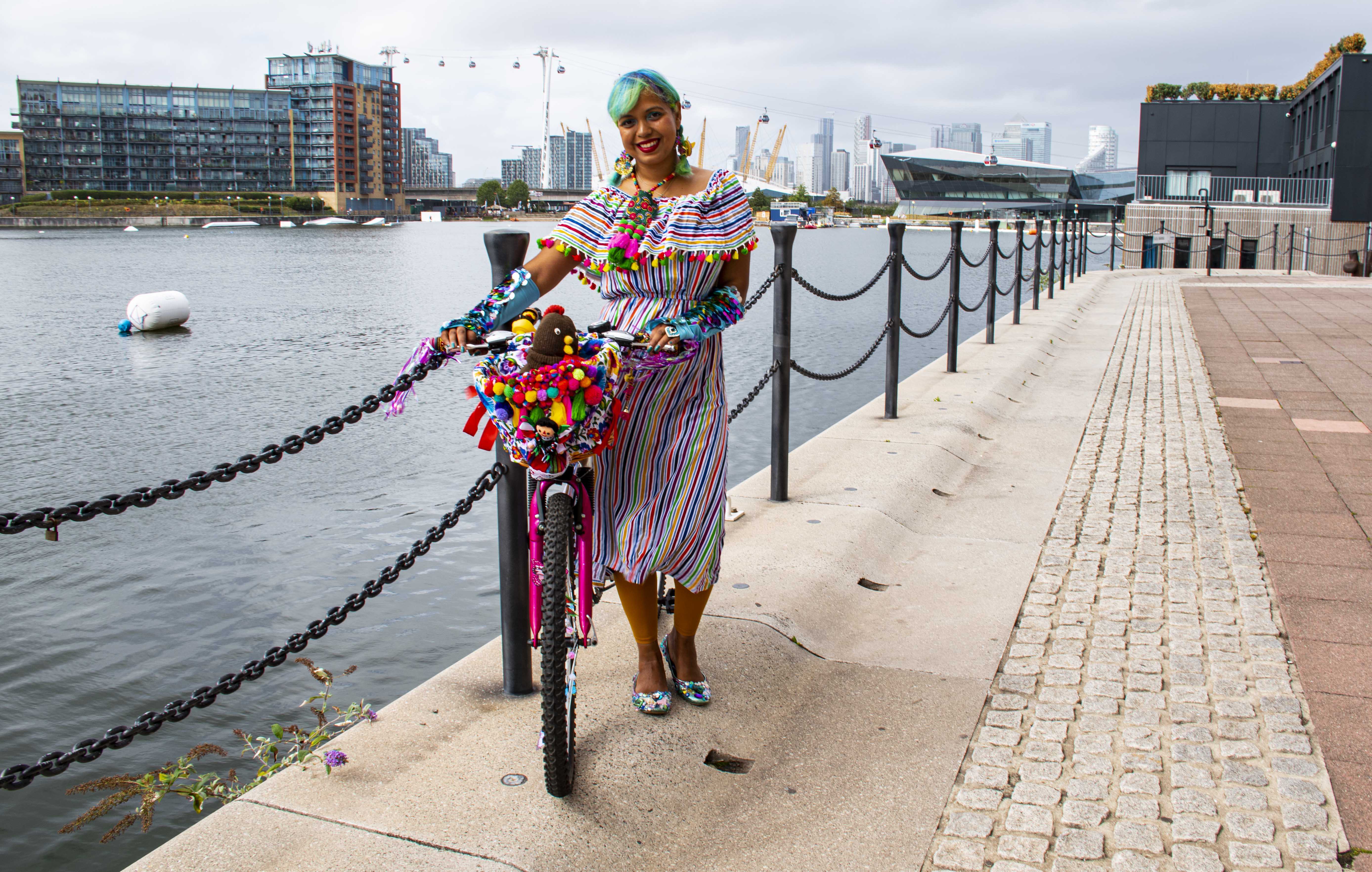 Momtaz with her bike at the Royal Docks