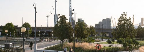 Scene with planting, people and cable cars overhead