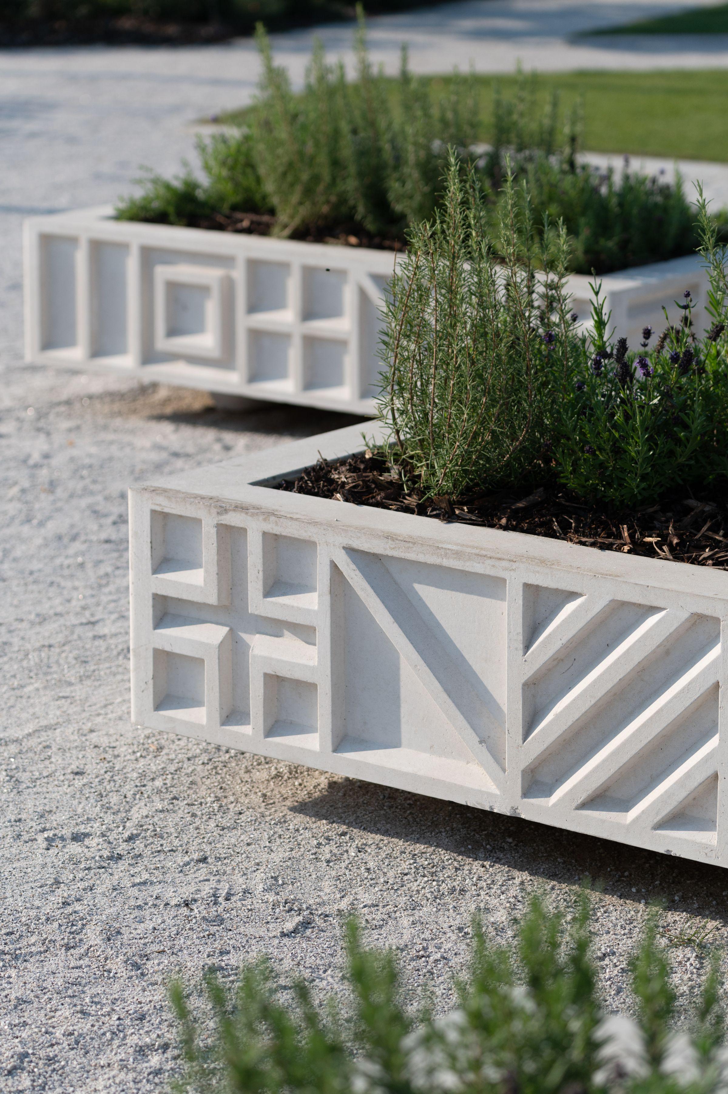 Royal Docks-branded containers with plants