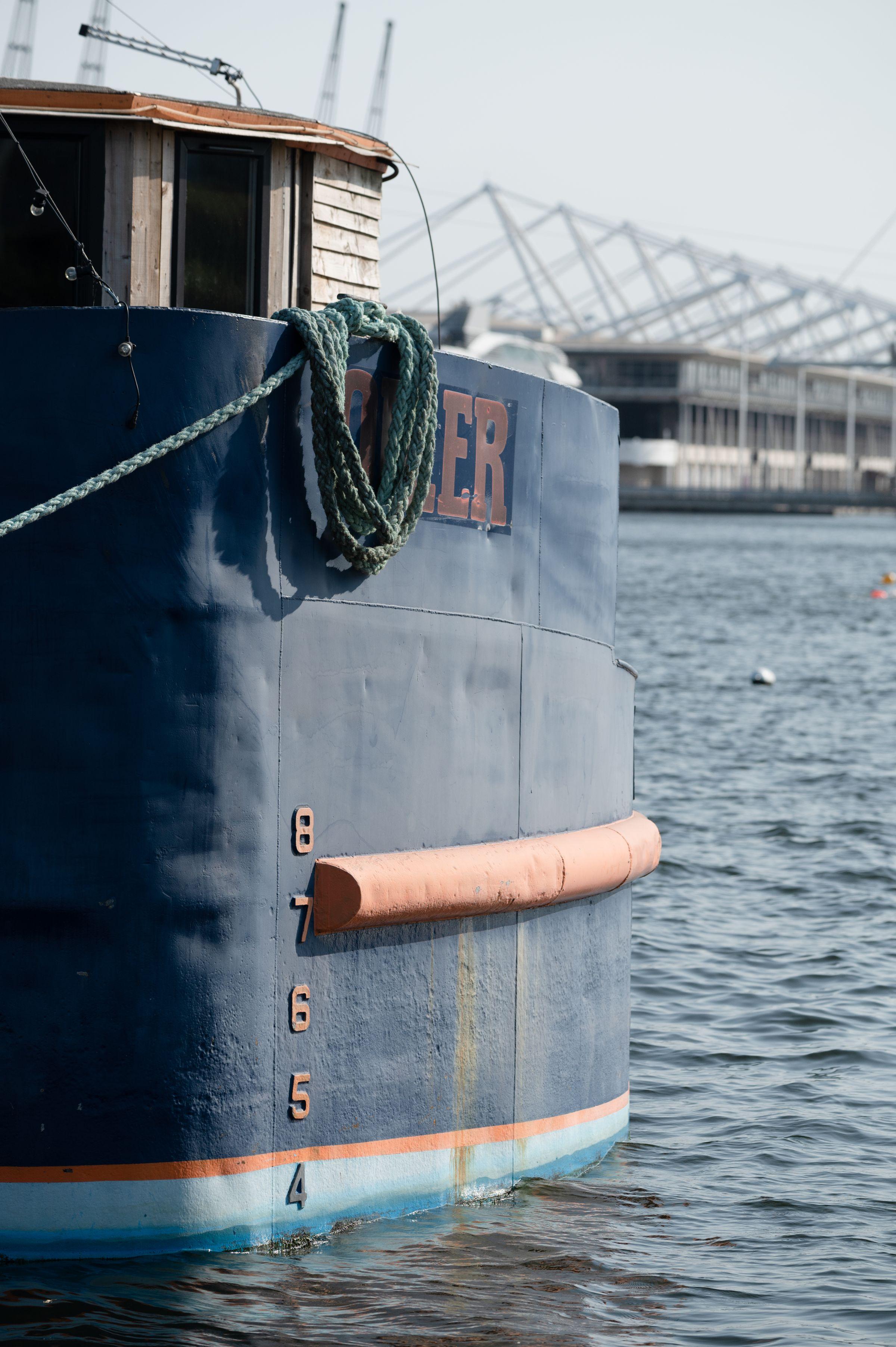 Edge of a boat overlooking the dock