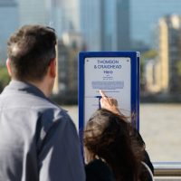 Couple looking at The Line info signage