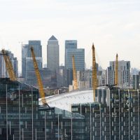 An image of Canary Wharf with The O2 in the foreground