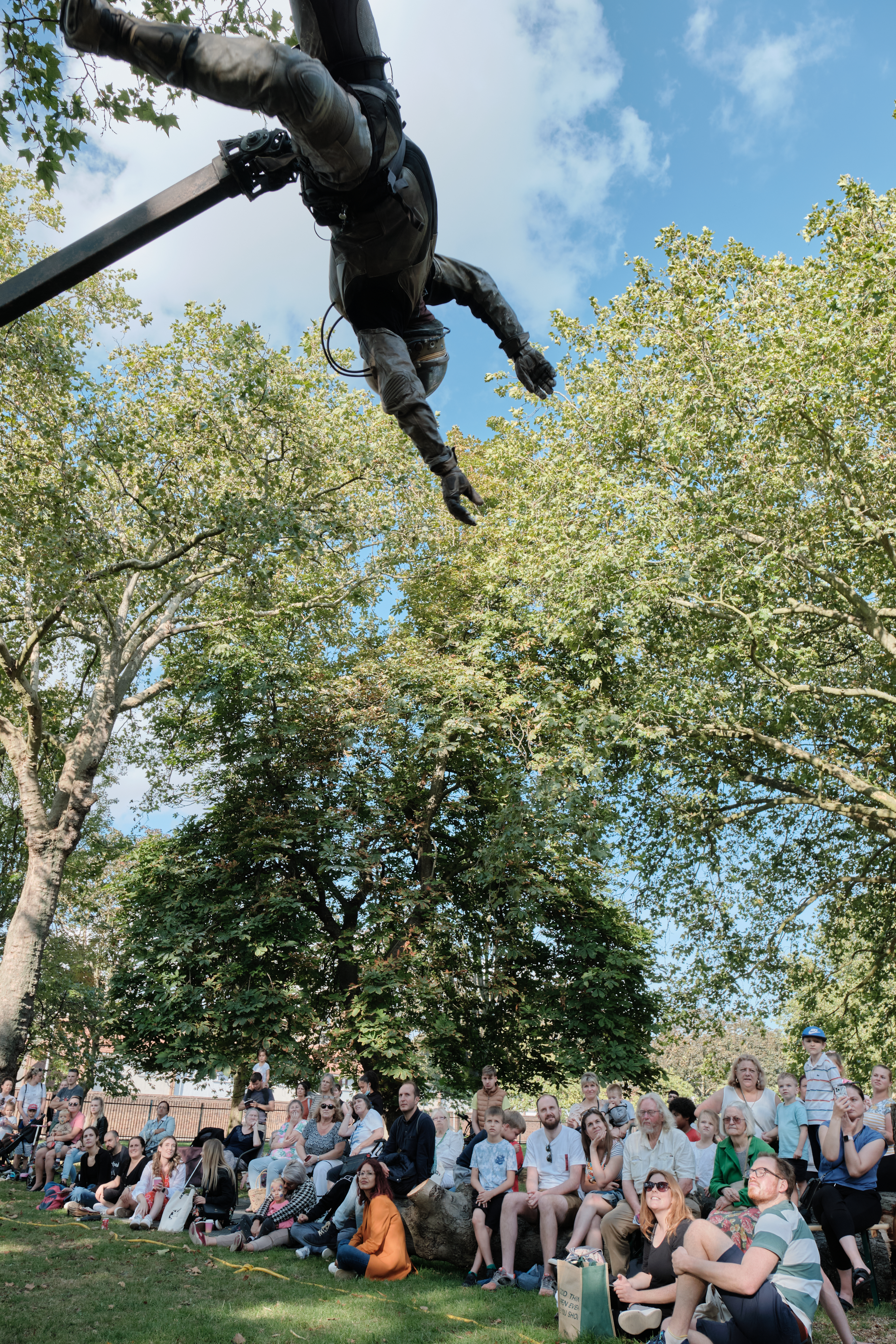 Urban astronaut actor is suspended above audience