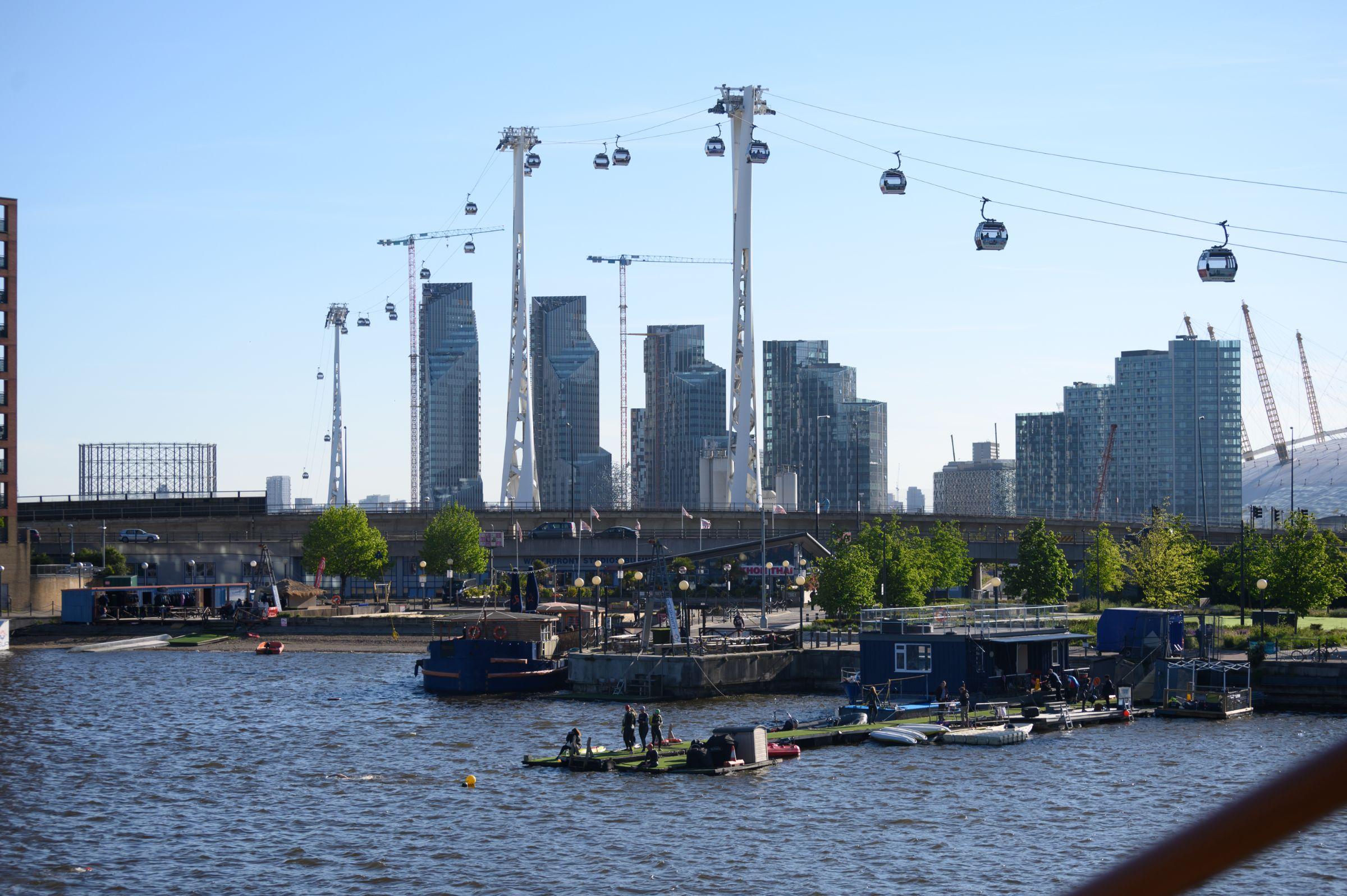 The water at the Royal Docks with the Emirates Cable Car in the background