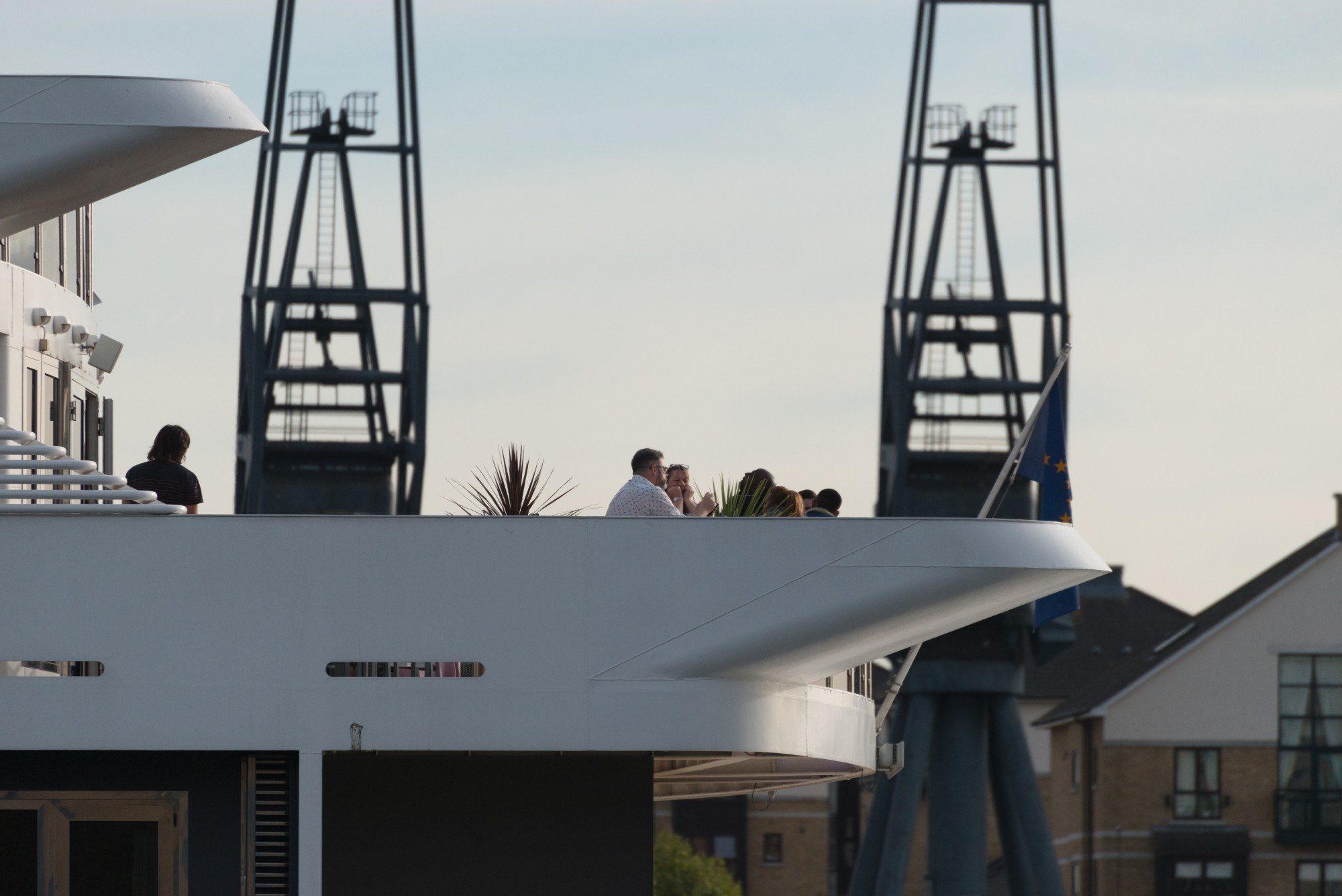 People drinking on the deck in summer