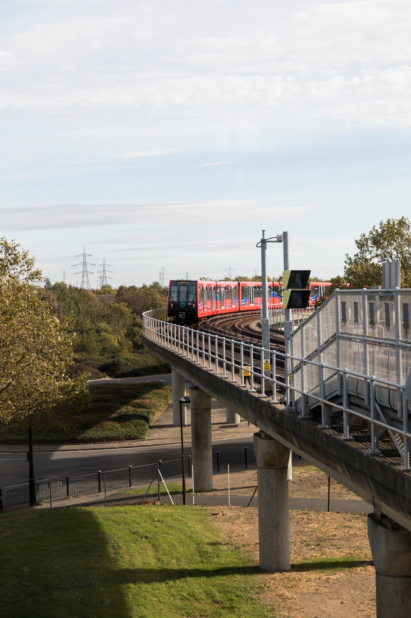 DLR train moving along tracks in the Royal Docks