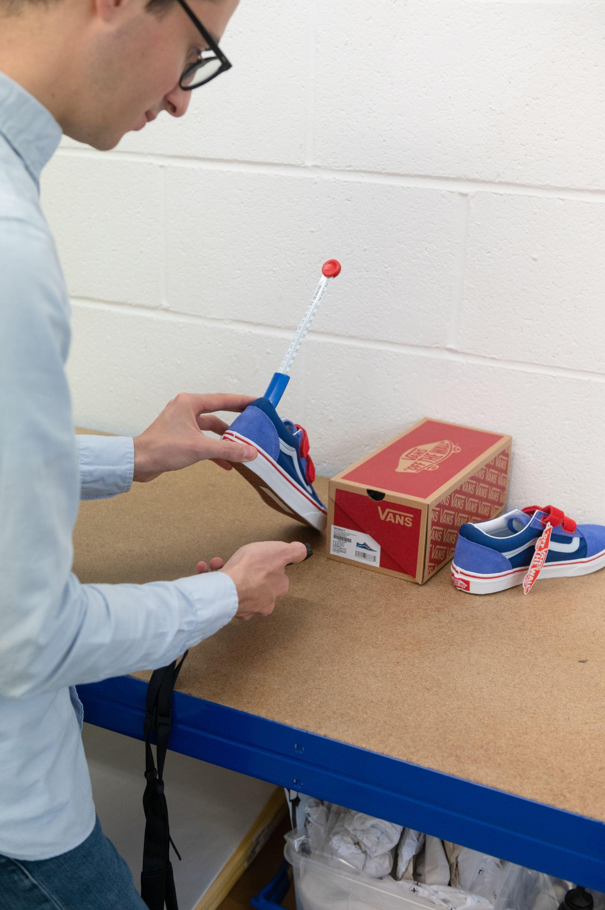 Eralp measuring a shoe
