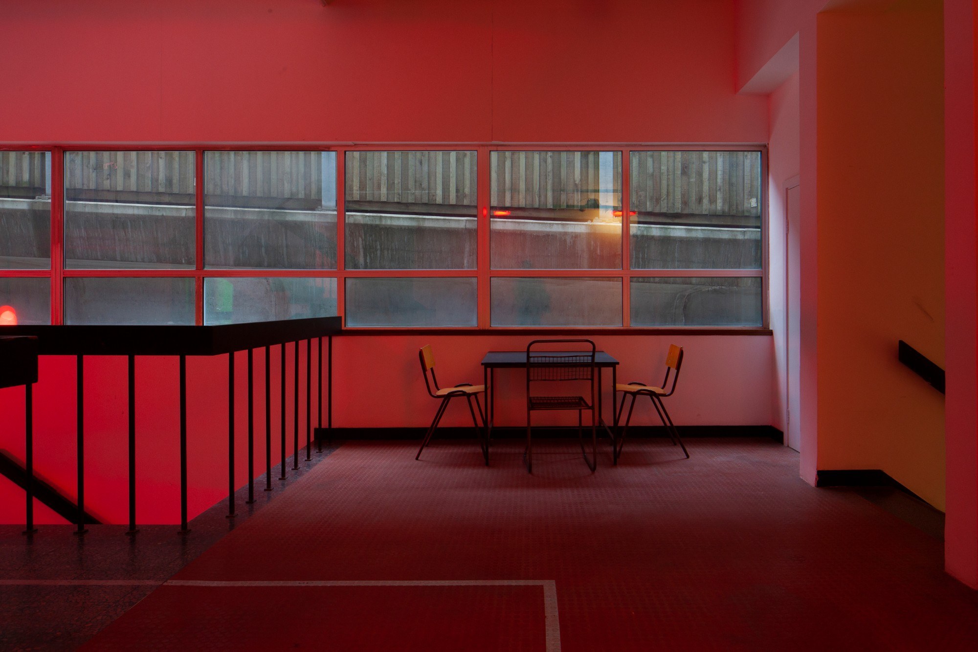 Stairwell lit with red lighting