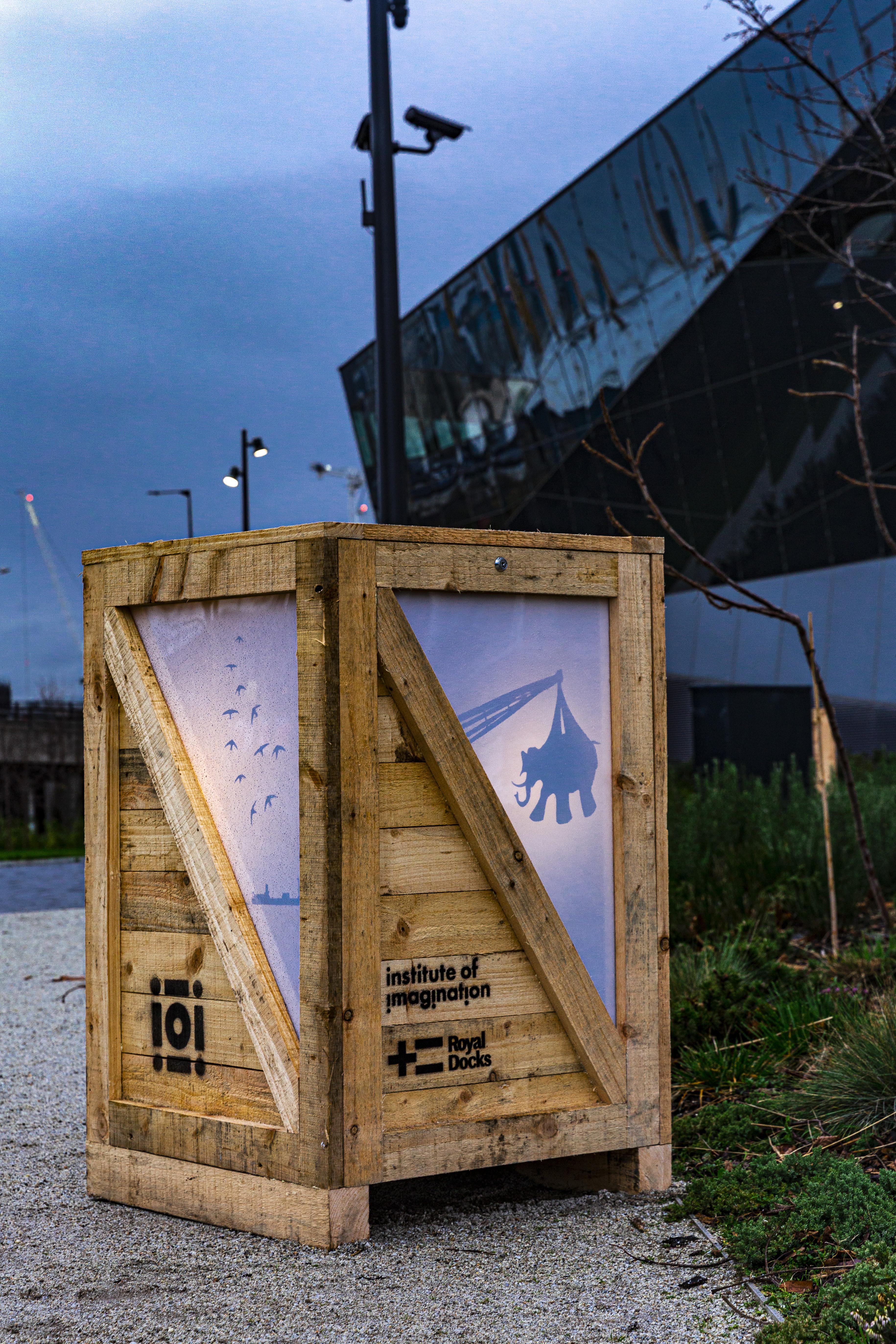 Lightbox outside the Crystal building with shapes projected onto it