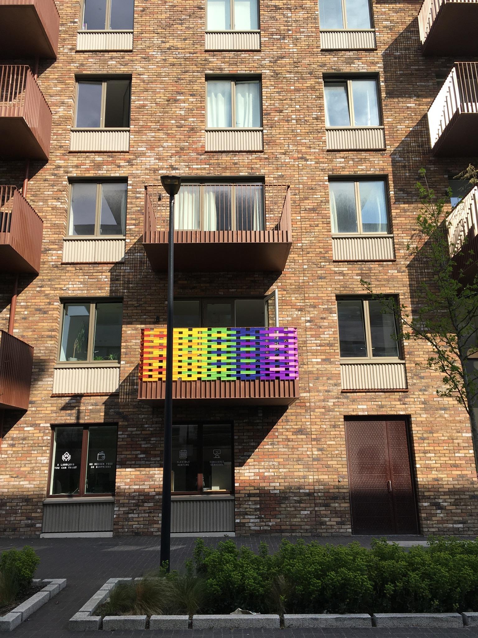 Balcony covered in rainbow ribbon pattern