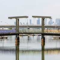 Bridge over Royal Albert Wharf decorated in rainbow ribbon