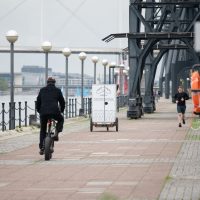 Loafly's white delivery bike seen driving off along the dockside