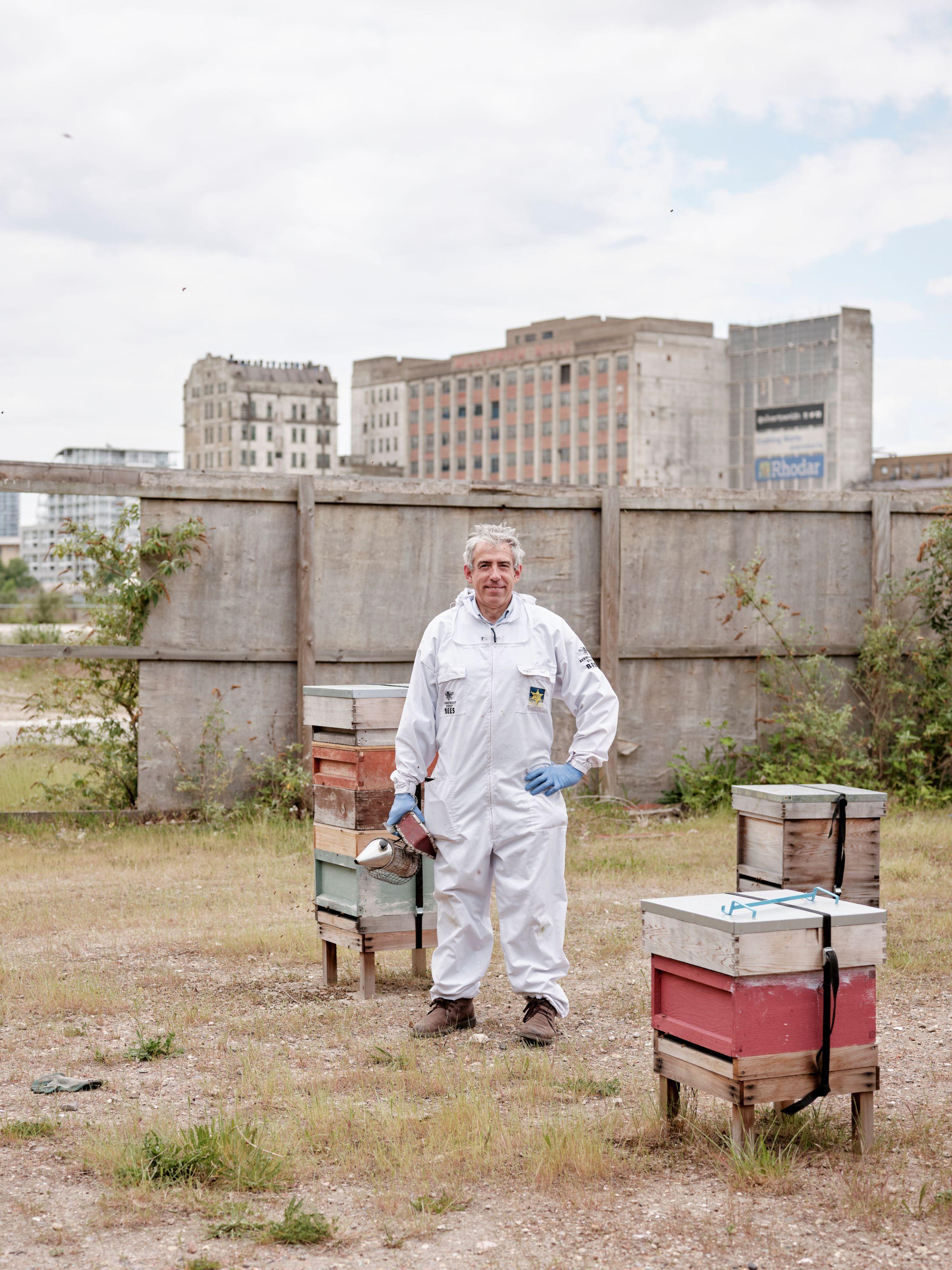 A beekeeper with his mask removed