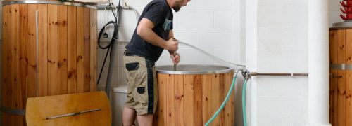 A man brewing beer at the Husk Brewery at the Royal Docks