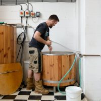 A man brewing beer at the Husk Brewery at the Royal Docks