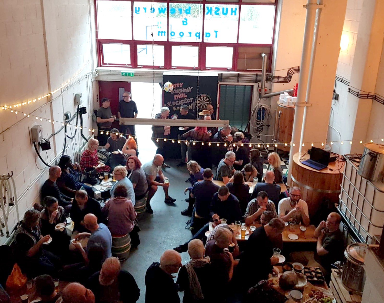 A large crowd of people at Husk Brewing