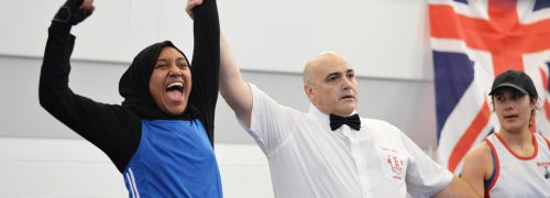 Woman cheering in boxing ring