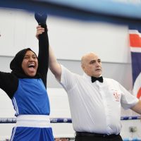 Woman cheering in boxing ring