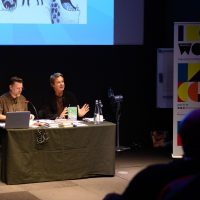 Julian Clary in front of an audience at Newham Word Festival