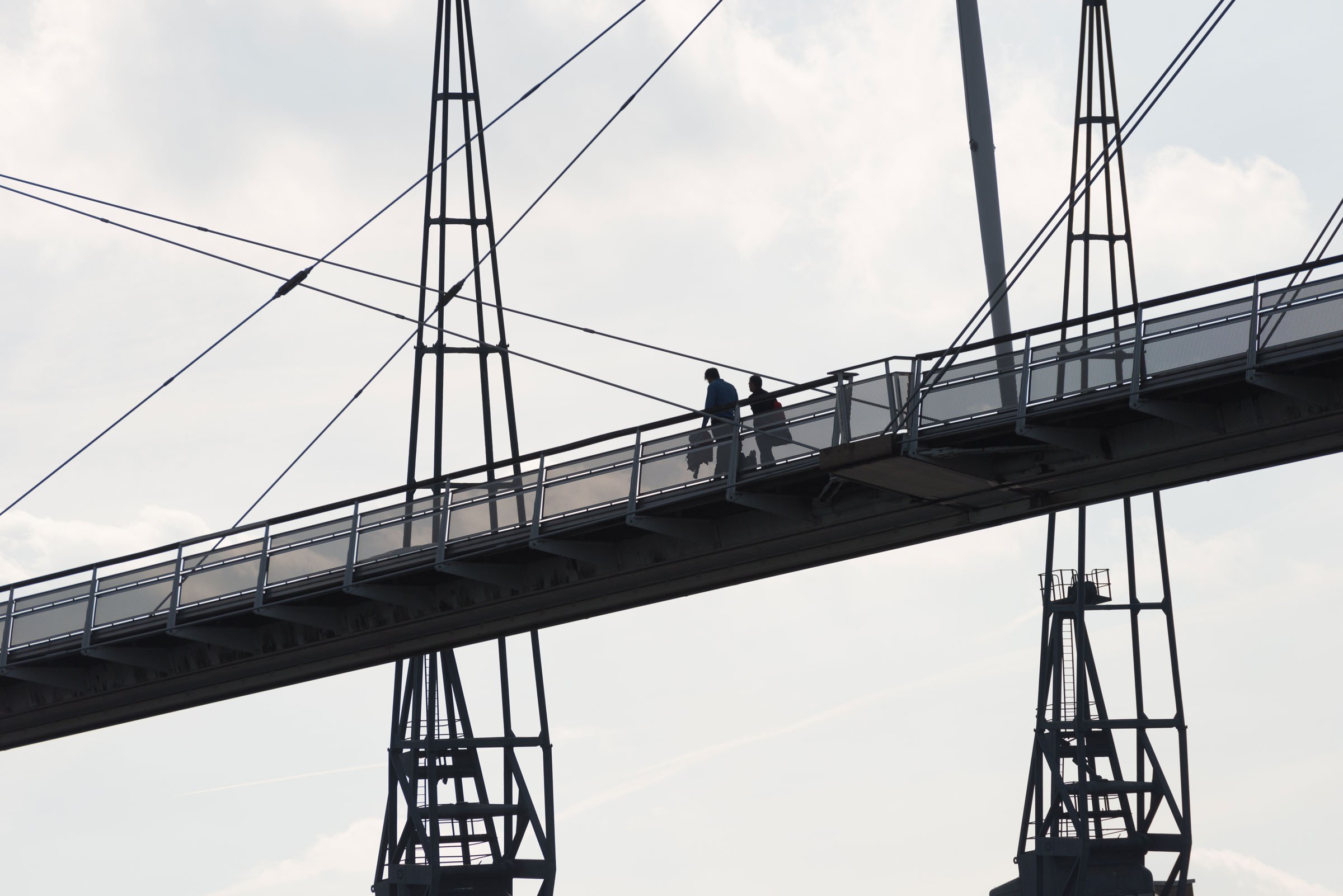 People crossing the Royal Victoria foot bridge