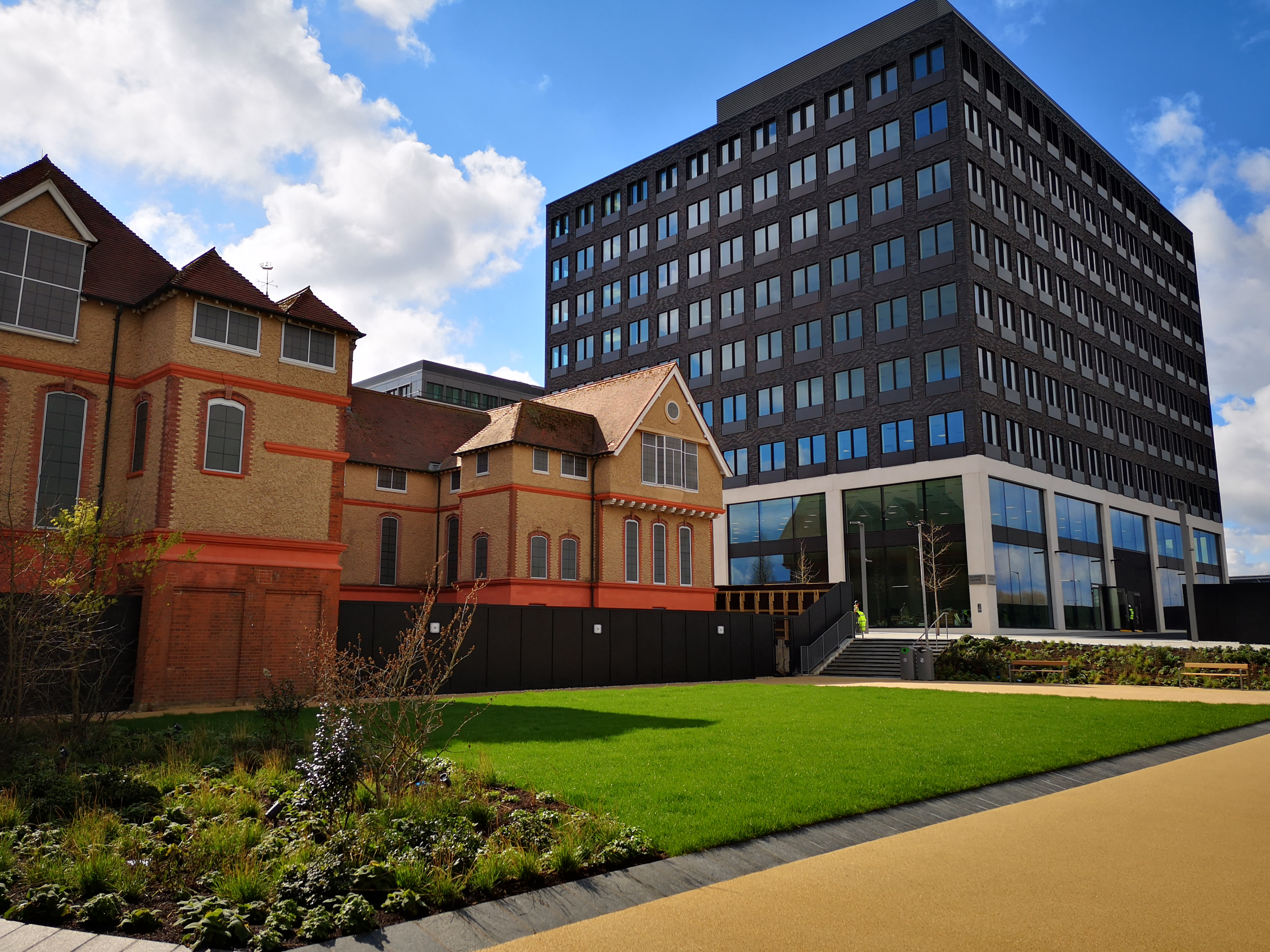 Buildings at the Royal Albert Docks with a neat green lawn