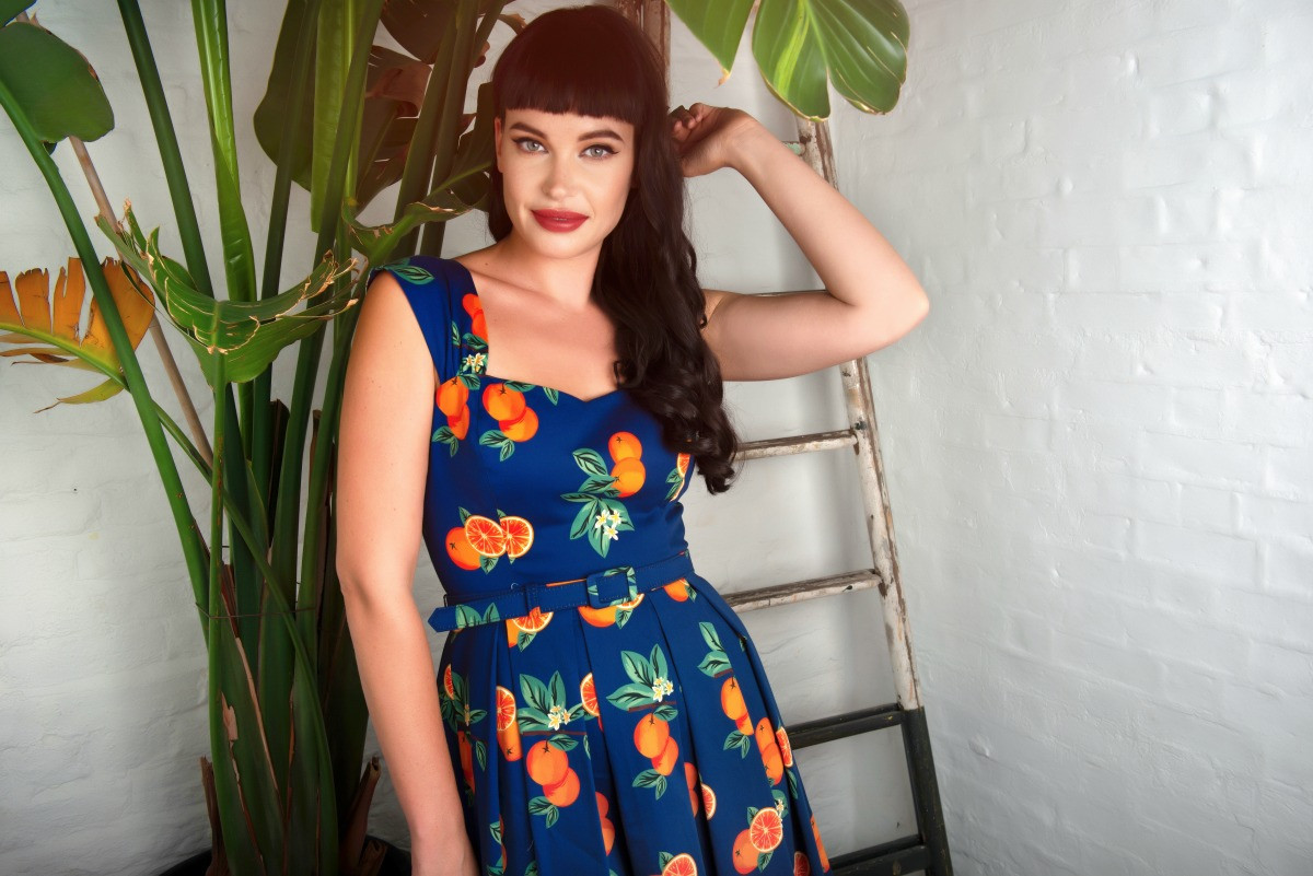 A woman modelling the collectif summer collection