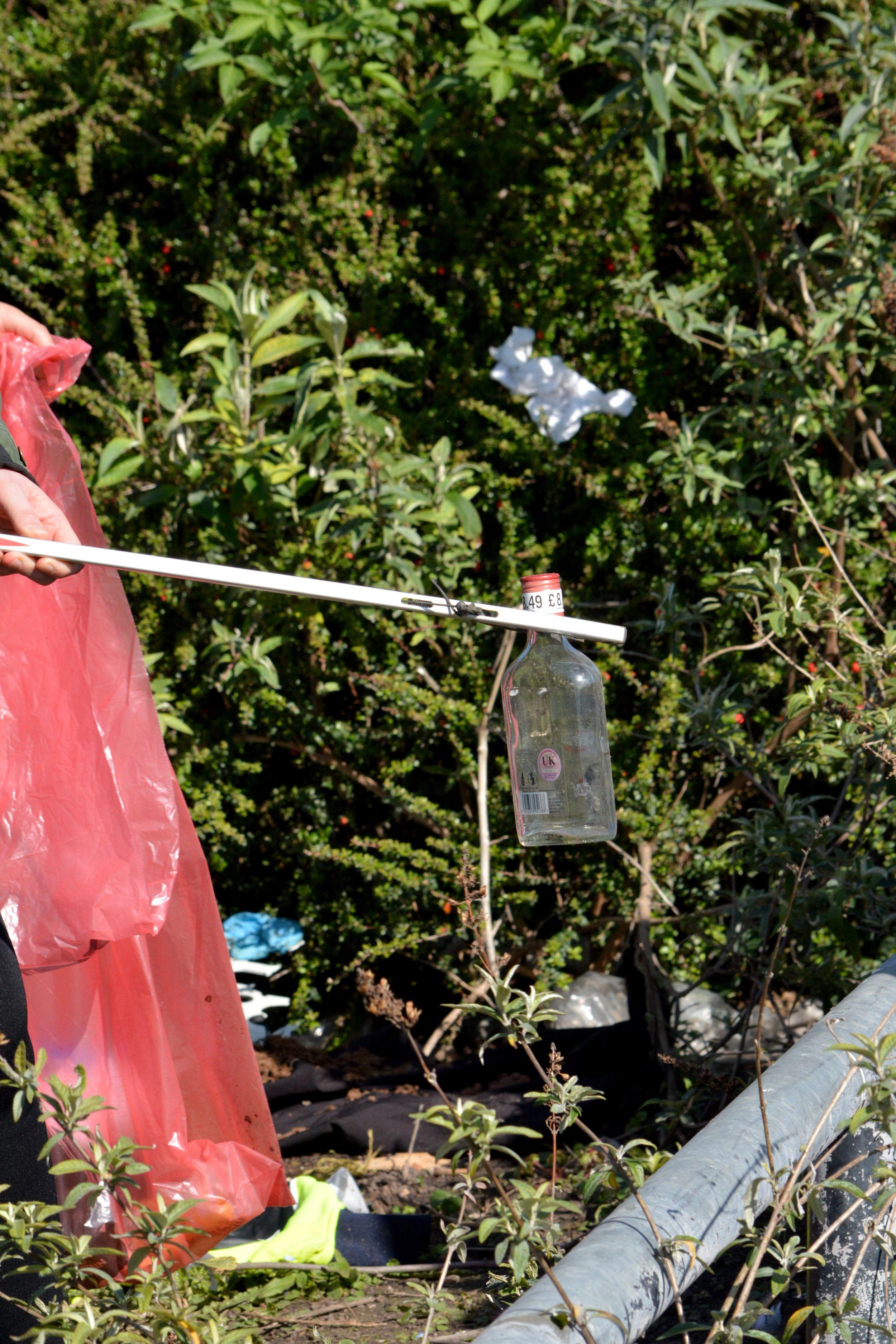 Litter being picked up with a litter picker