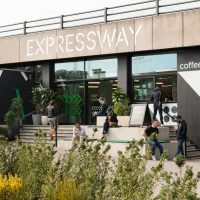 Expressway's dockside entrance on the side of Royal Victoria Dock, with coffee and planting