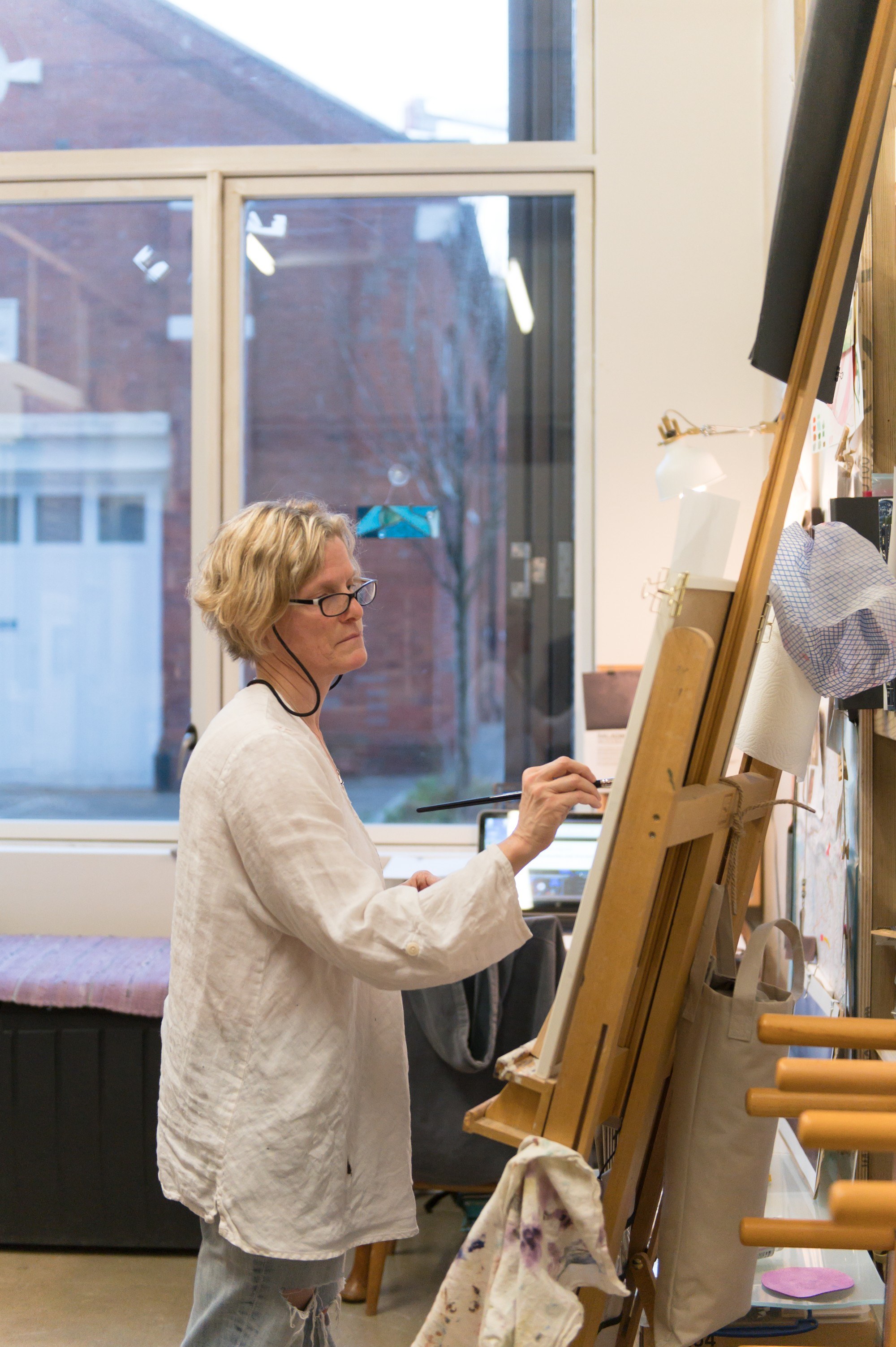 Artist painting on an easel