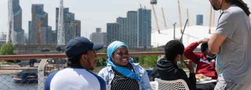 Youth network members in conversation with the cable car in the background