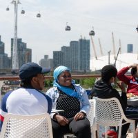 Youth network members in conversation with the cable car in the background