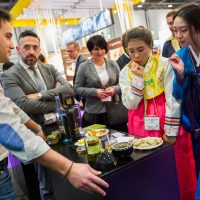 International Food & Drink Event, people tasting samples