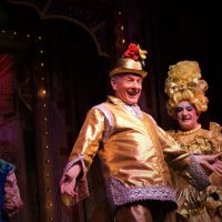 A panto performance with gleaming gold costumes